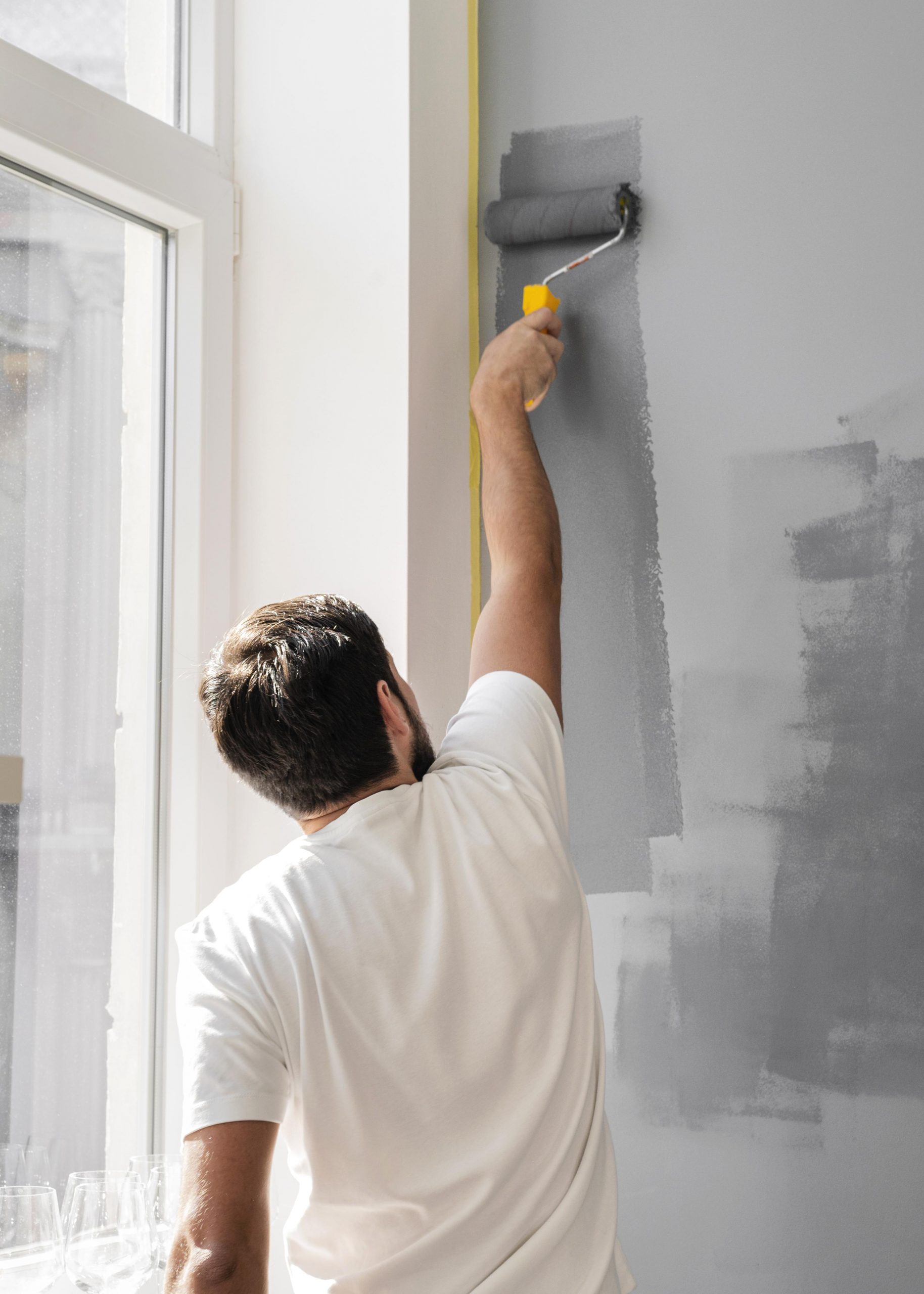 medium-shot-man-painting-wall